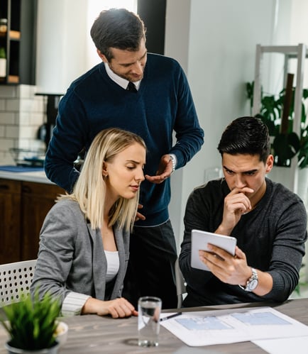 young-couple-feeling-uncertain-while-using-digital-tablet-meeting-with-their-insurance-agent-home-2